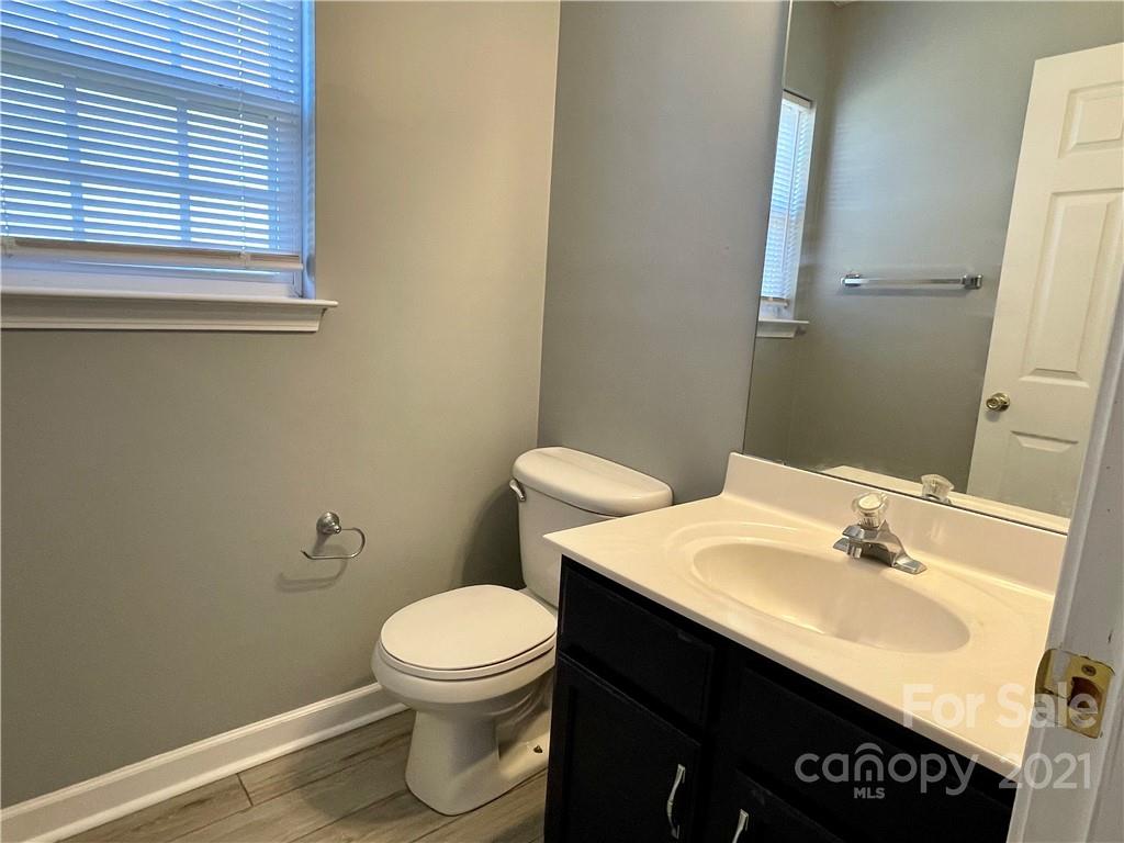5514 Rogers Road Indian Trail, NC 28079 - Photo 6 of 34 a bathroom with a sink a toilet and a mirror