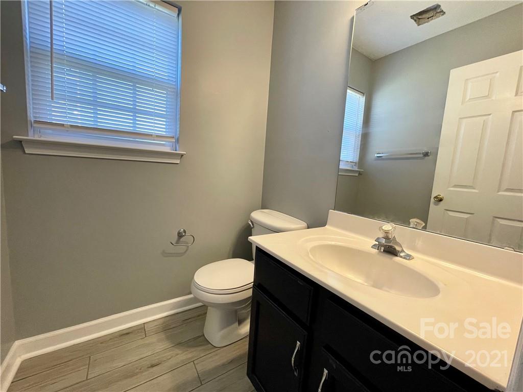5514 Rogers Road Indian Trail, NC 28079 - Photo 7 of 34 a bathroom with a sink vanity and toilet
