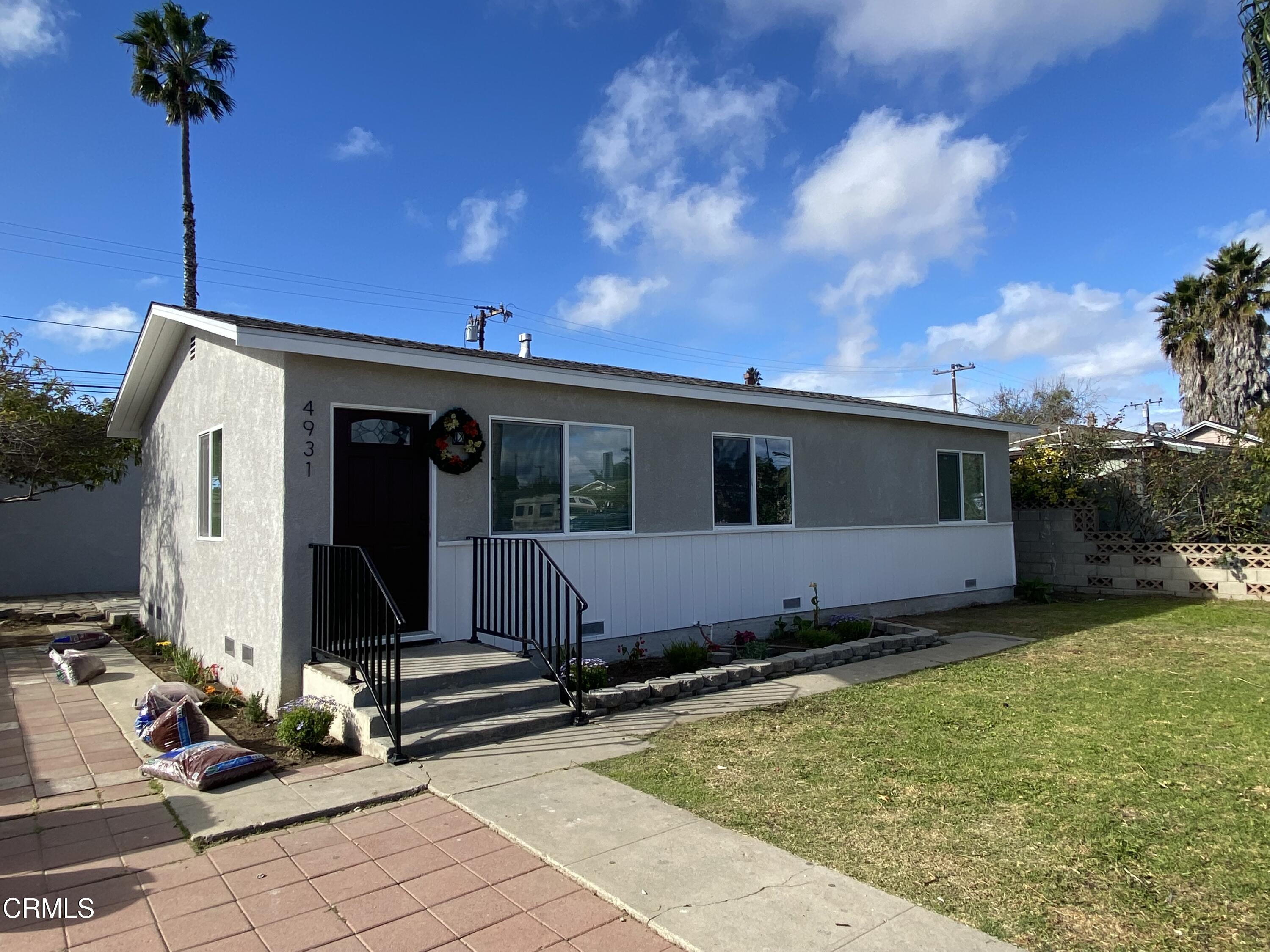 a view of house with yard and entertaining space