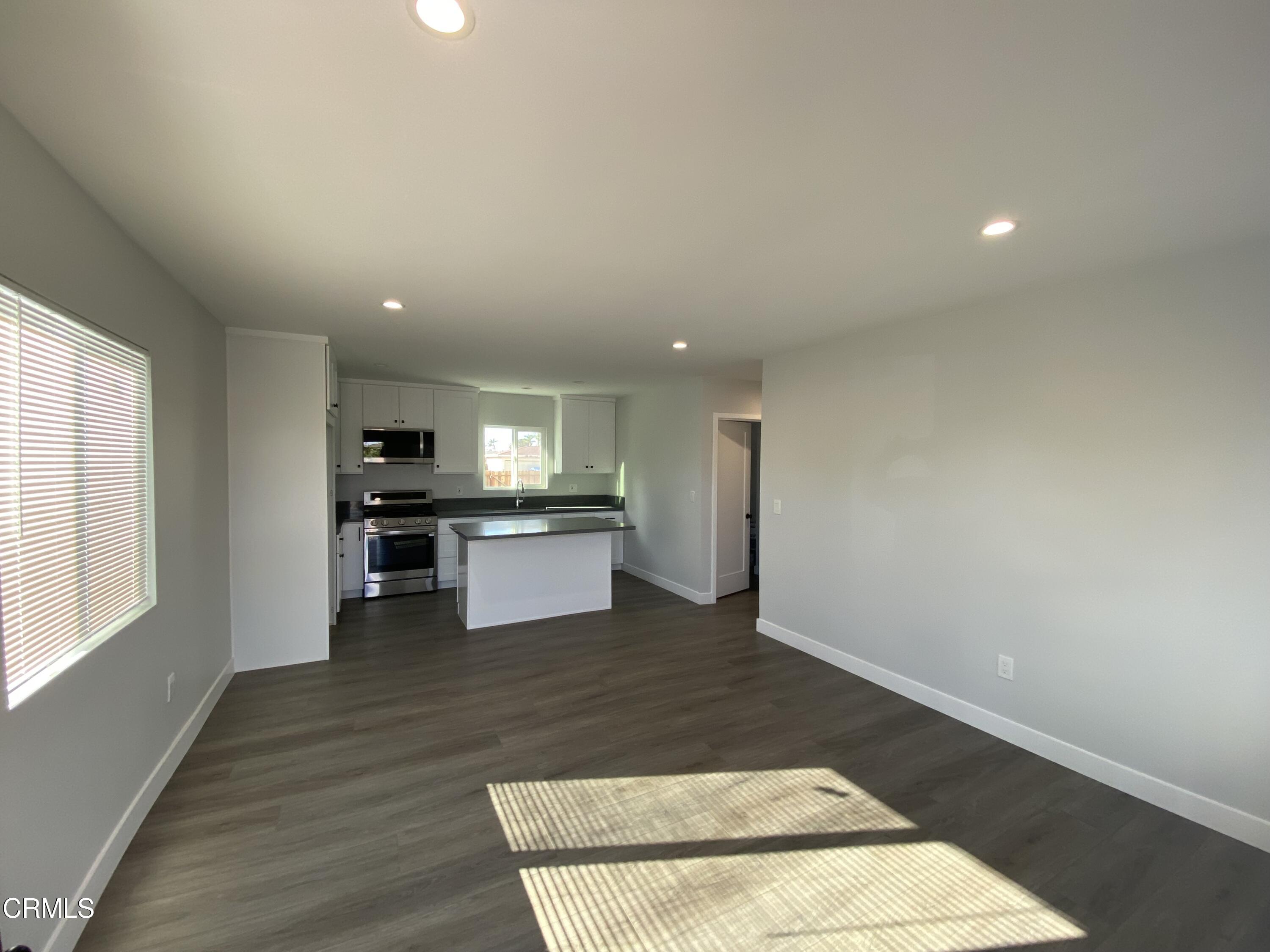 4931 Refsing Place Oxnard, CA 93033 - Photo 3 of 16 a view of kitchen with wooden floor