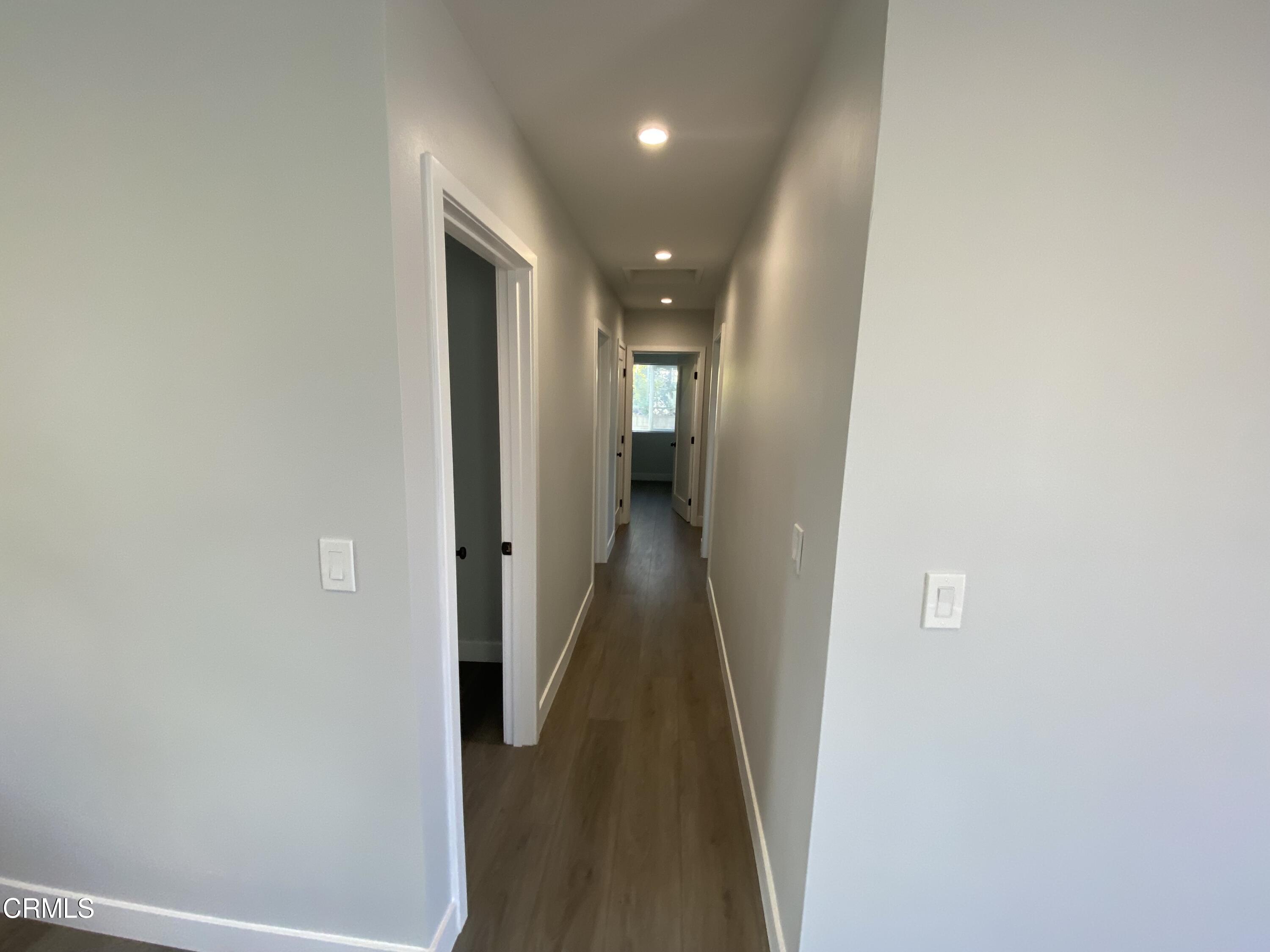 4931 Refsing Place Oxnard, CA 93033 - Photo 9 of 16 a view of a hallway with wooden floor