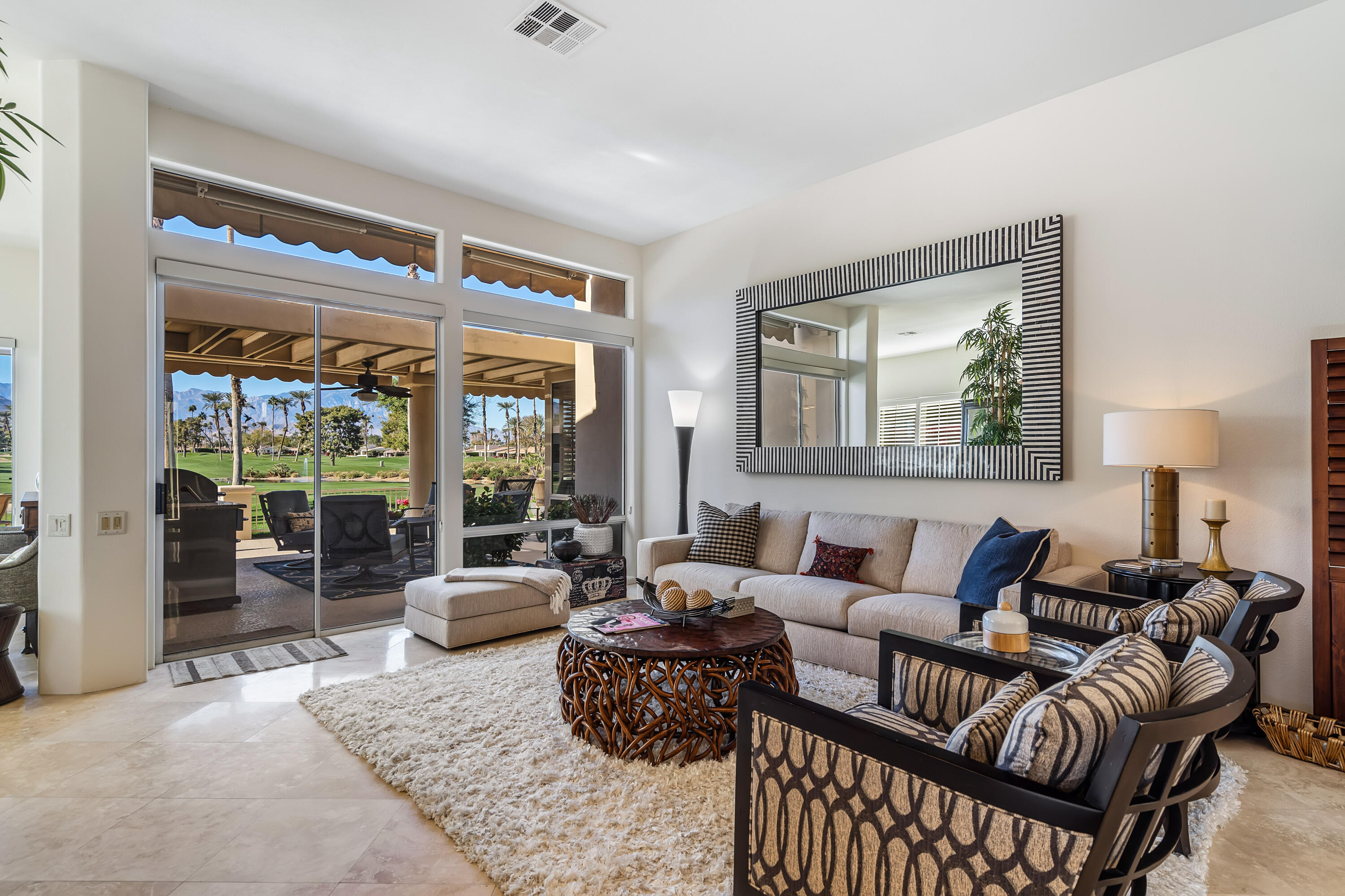 75762 Vista Del Rey Indian Wells, CA 92210 - Photo 12 of 49 a living room with furniture and large windows