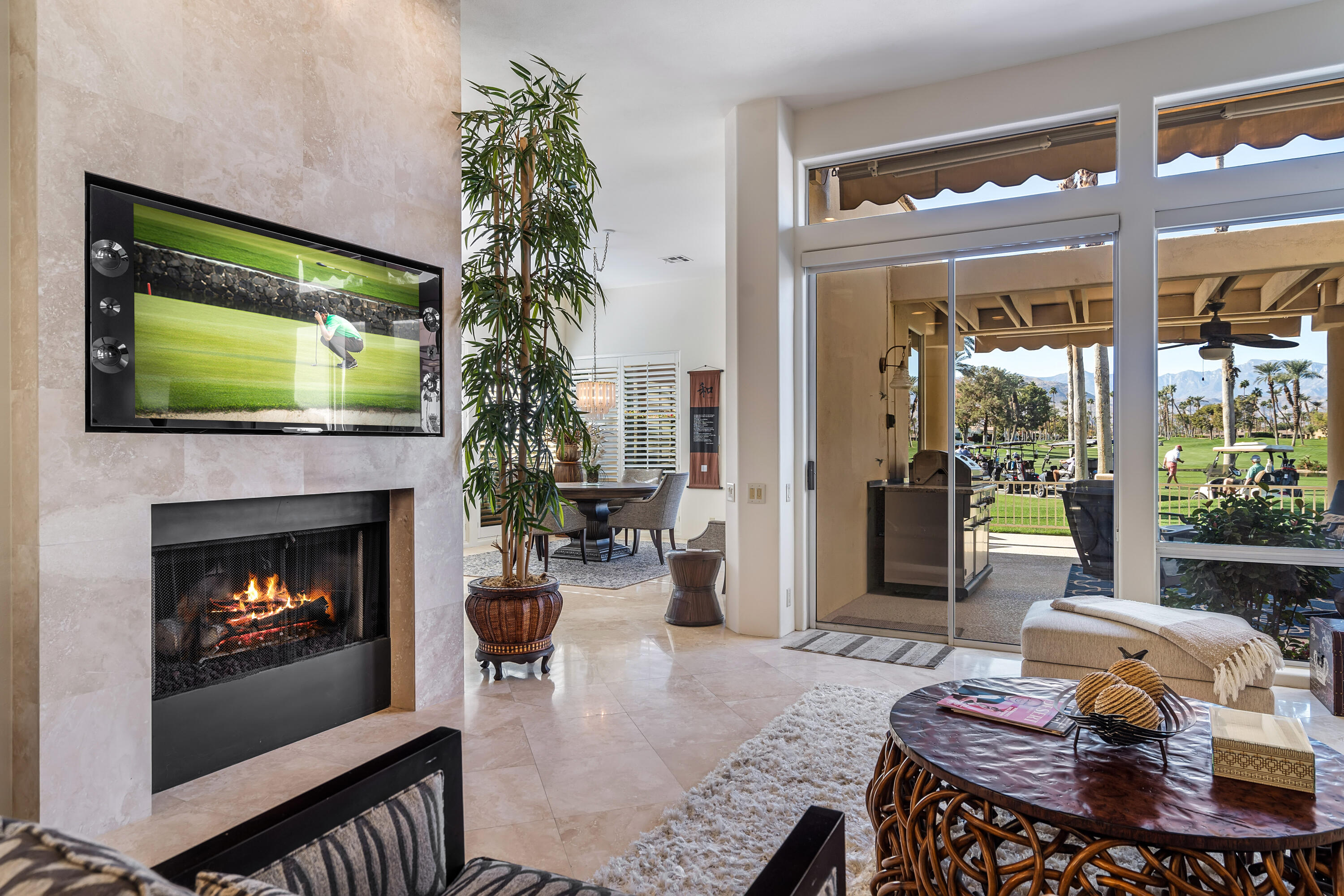 75762 Vista Del Rey Indian Wells, CA 92210 - Photo 13 of 49 a living room with furniture a flat screen tv and a fireplace