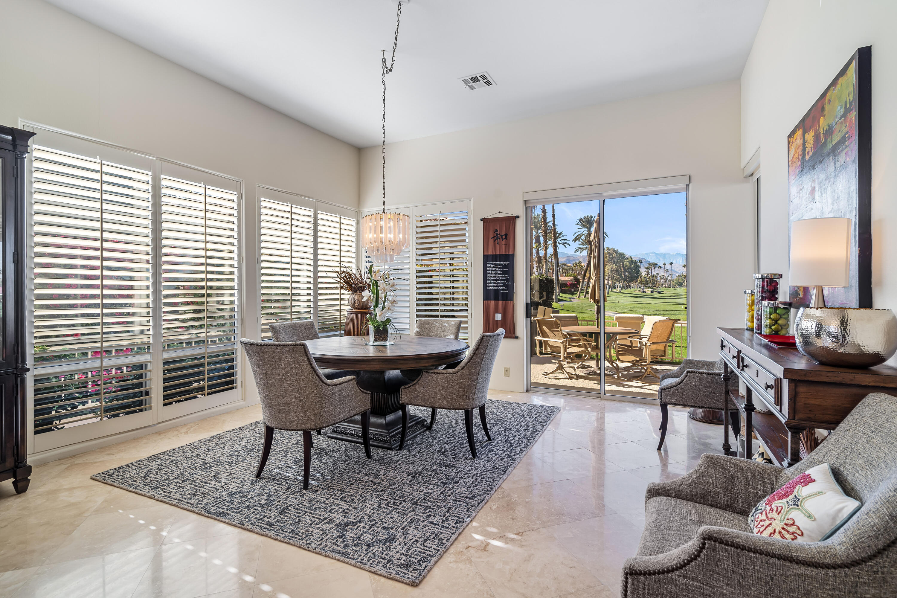 75762 Vista Del Rey Indian Wells, CA 92210 - Photo 17 of 49 a view of a dining room with furniture window and outside view