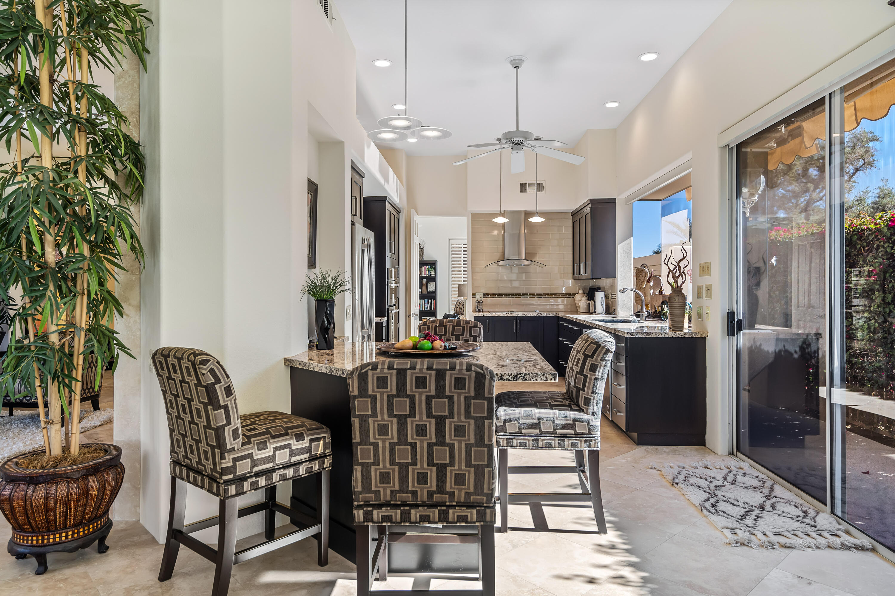 75762 Vista Del Rey Indian Wells, CA 92210 - Photo 19 of 49 a view of a dining room with furniture