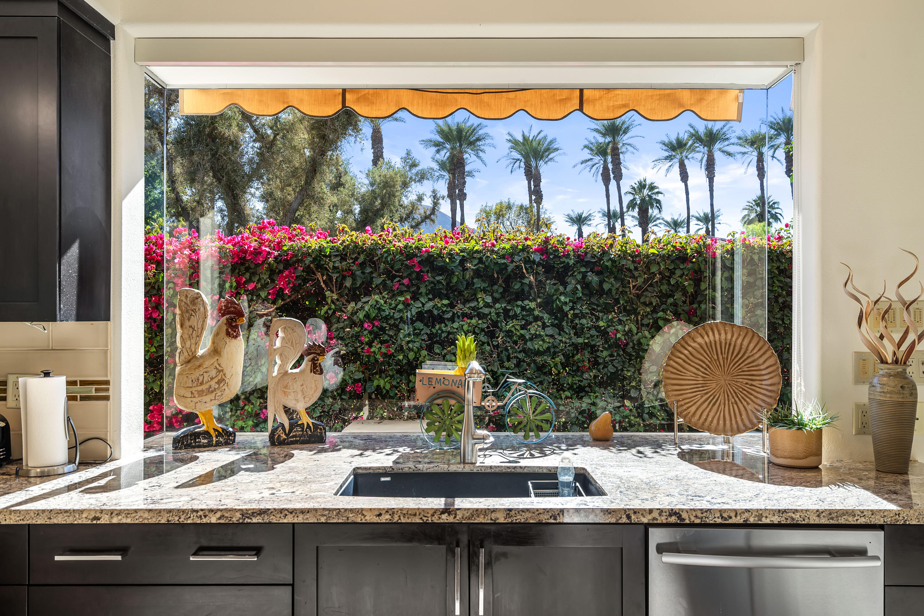 75762 Vista Del Rey Indian Wells, CA 92210 - Photo 23 of 49 a view of a kitchen with a sink and a large window