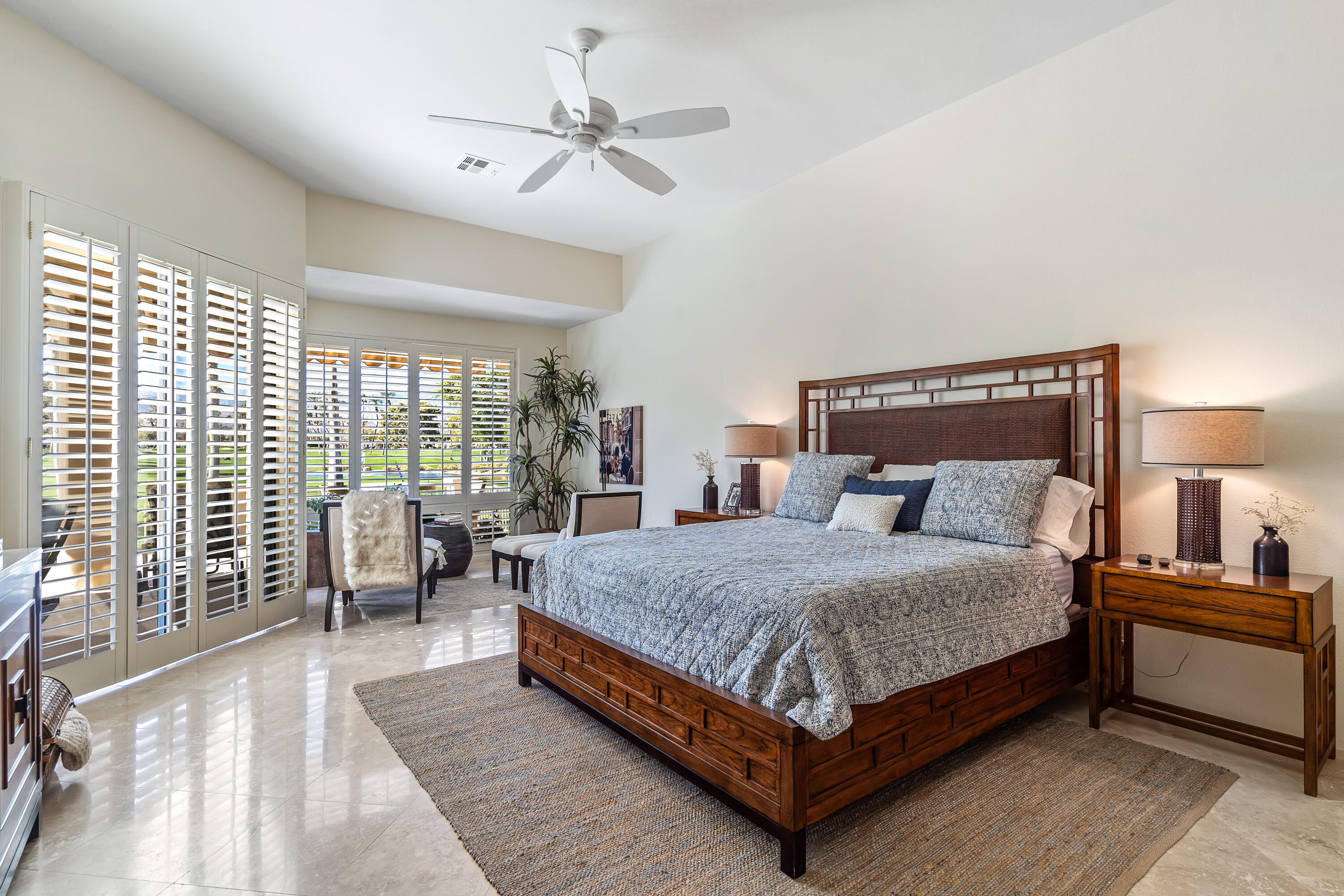 75762 Vista Del Rey Indian Wells, CA 92210 - Photo 28 of 49 a bedroom with a large bed and a large window