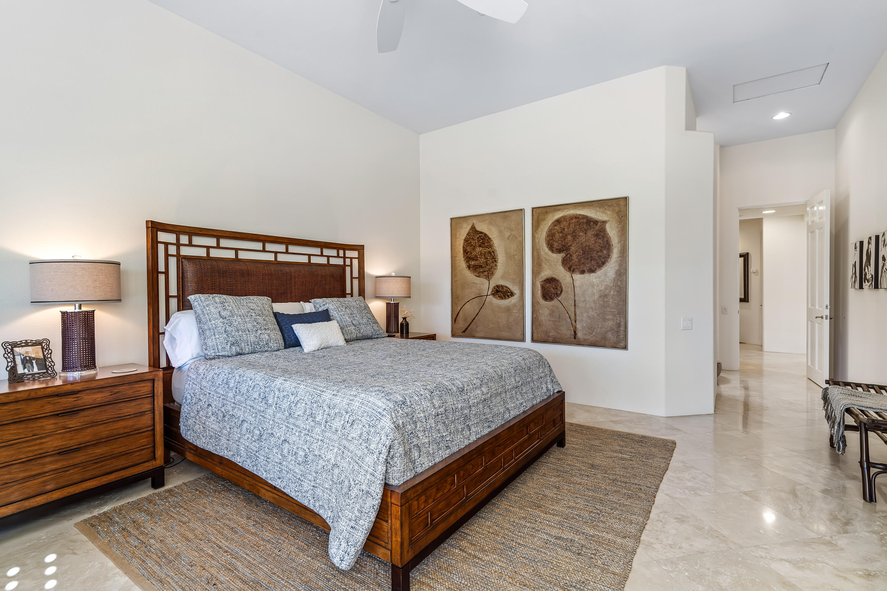 75762 Vista Del Rey Indian Wells, CA 92210 - Photo 30 of 49 a bedroom with a large bed and painting on the wall