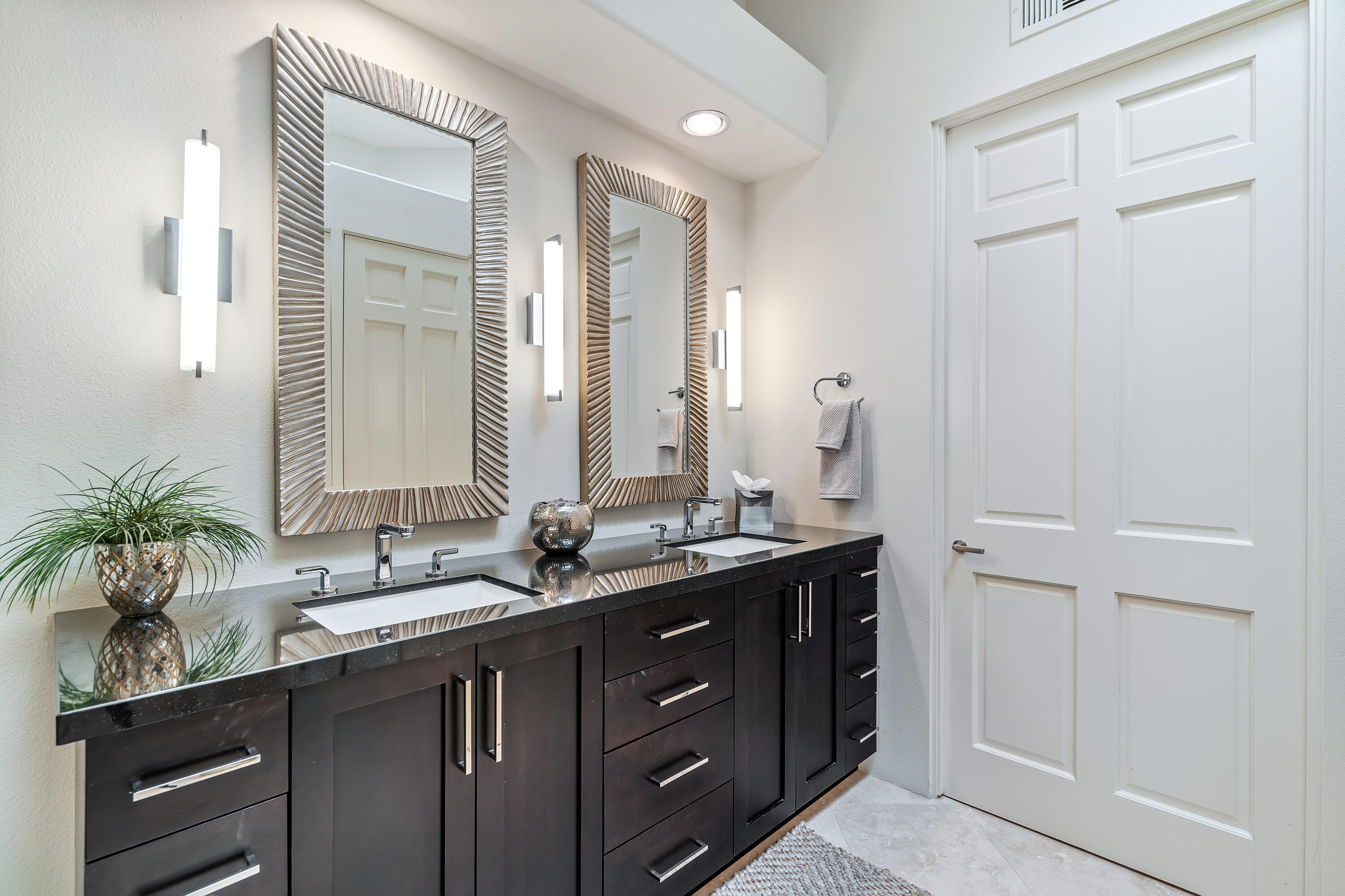 75762 Vista Del Rey Indian Wells, CA 92210 - Photo 33 of 49 a bathroom with a double vanity sink a large mirror and next to a window