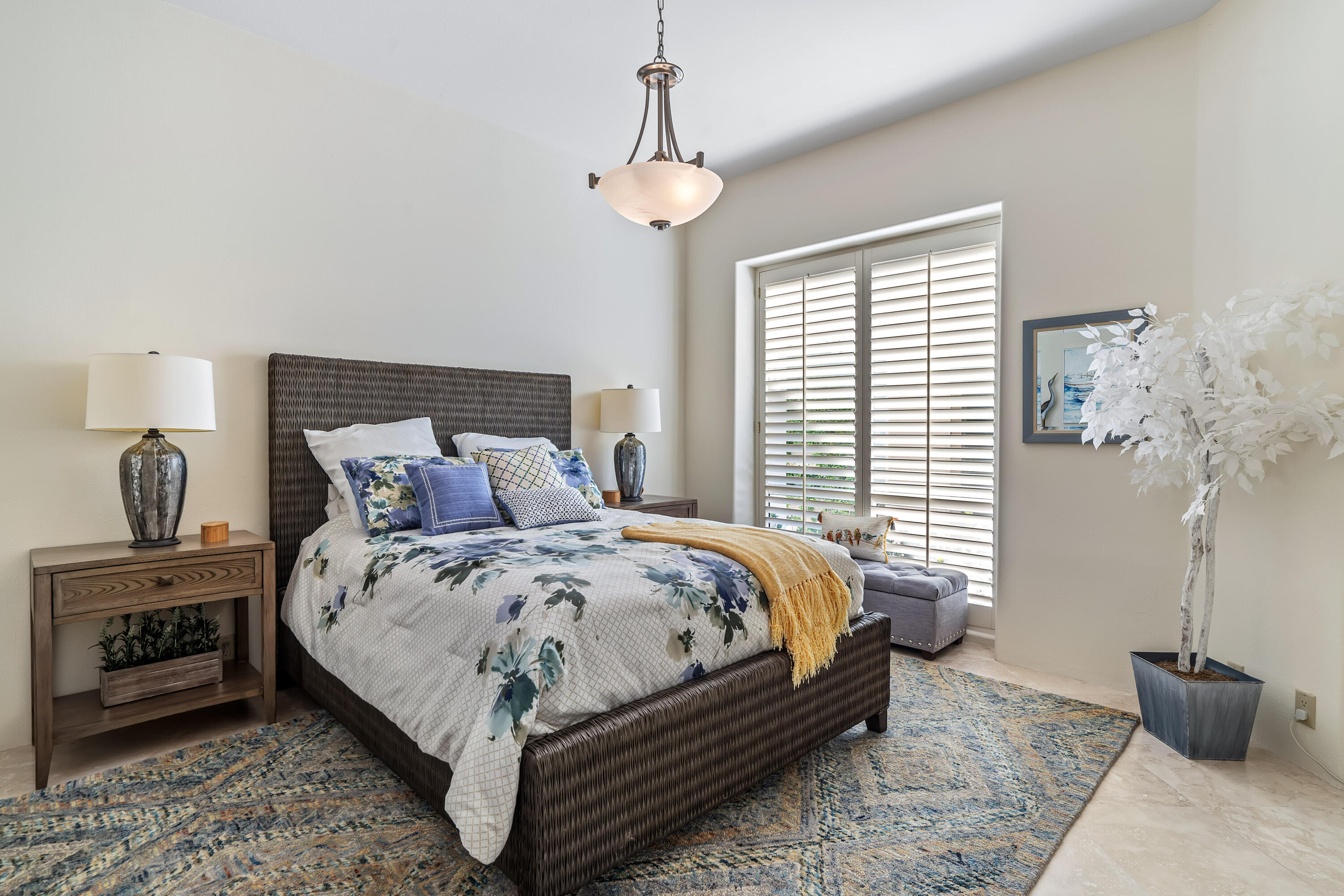 75762 Vista Del Rey Indian Wells, CA 92210 - Photo 37 of 49 a bedroom with bed and a chandelier