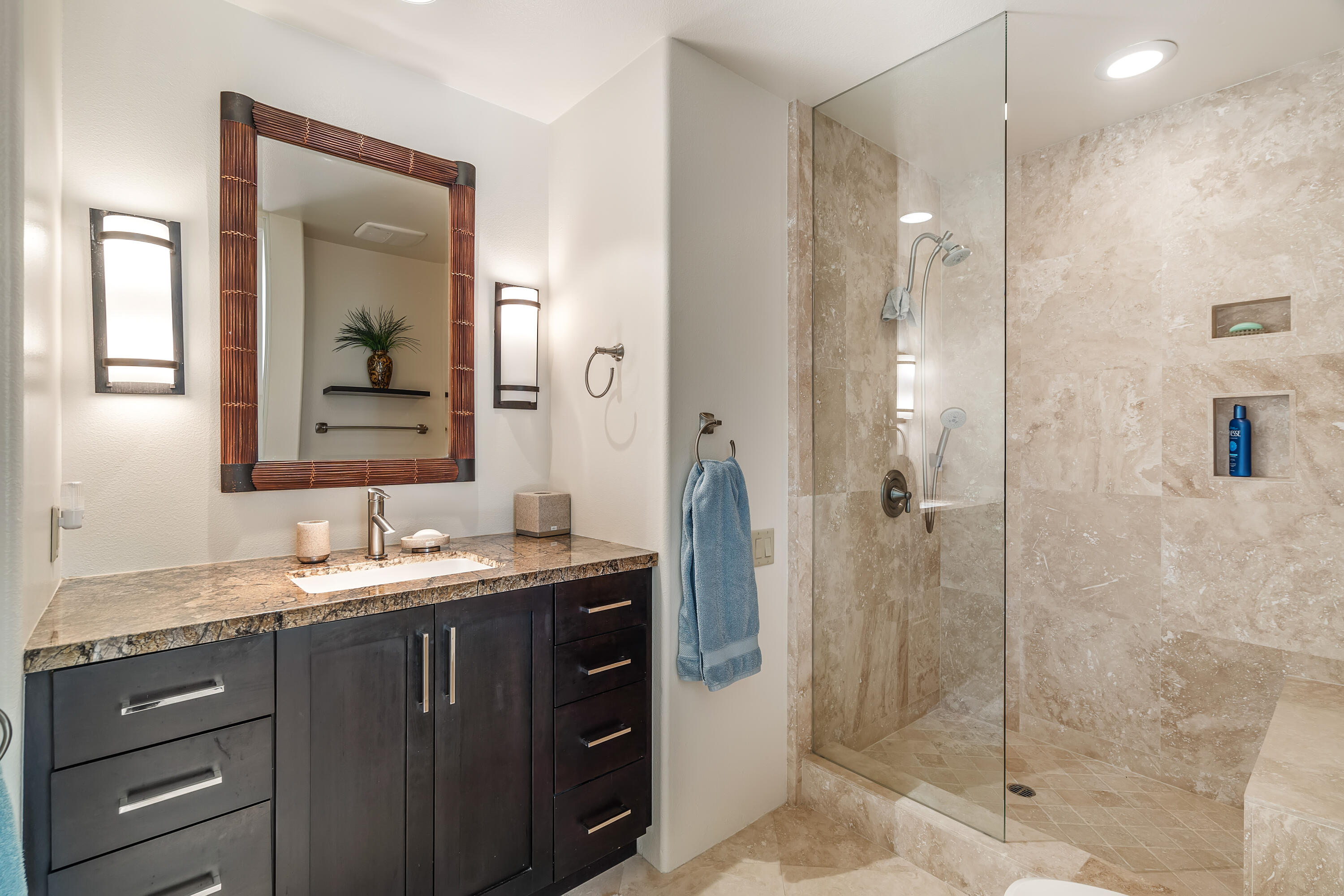 75762 Vista Del Rey Indian Wells, CA 92210 - Photo 40 of 49 a bathroom with a granite countertop sink mirror and shower