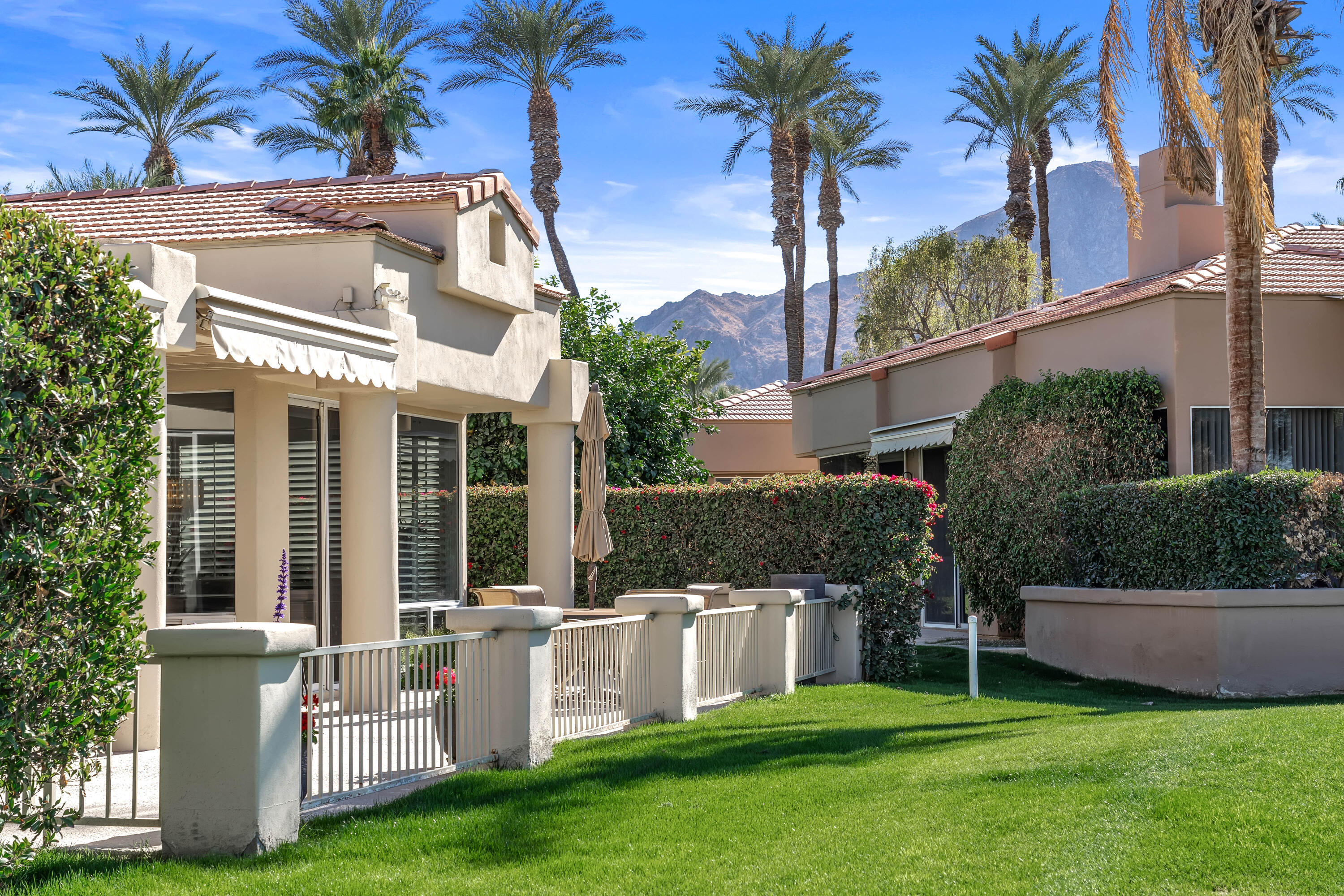 75762 Vista Del Rey Indian Wells, CA 92210 - Photo 42 of 49 a view of a house with a yard and plants