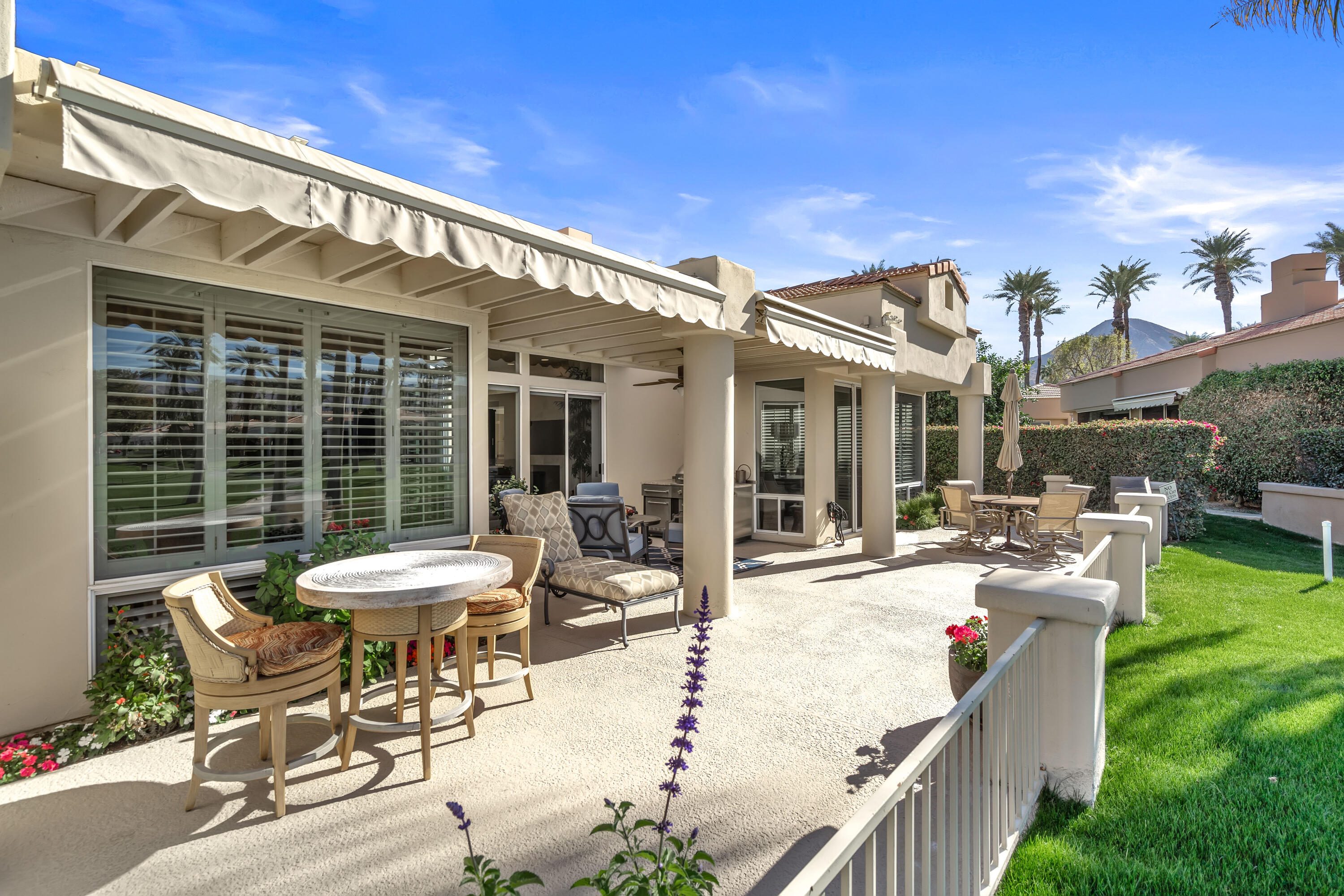 75762 Vista Del Rey Indian Wells, CA 92210 - Photo 47 of 49 a view of a patio with couches table and chairs and potted plants