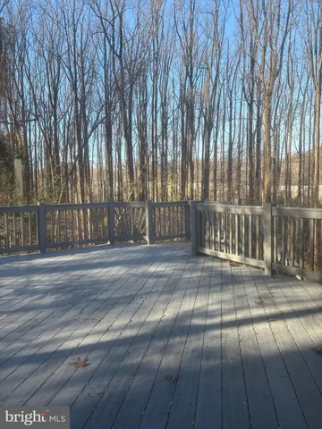 a kitchen with stainless steel appliances white cabinets and a refrigerator