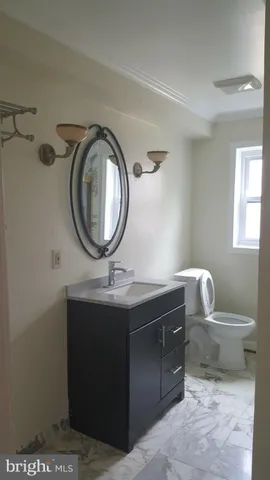 a view of a house with a tree