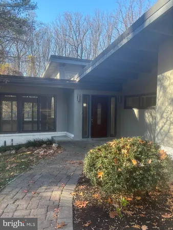 a view of a house with a tree