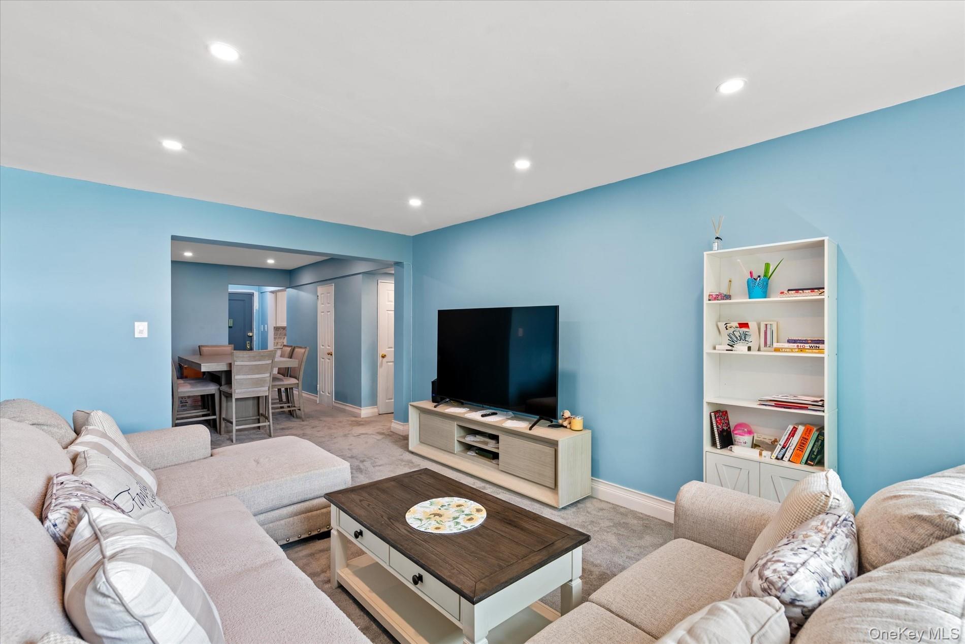 Living room featuring recessed lighting and baseboards