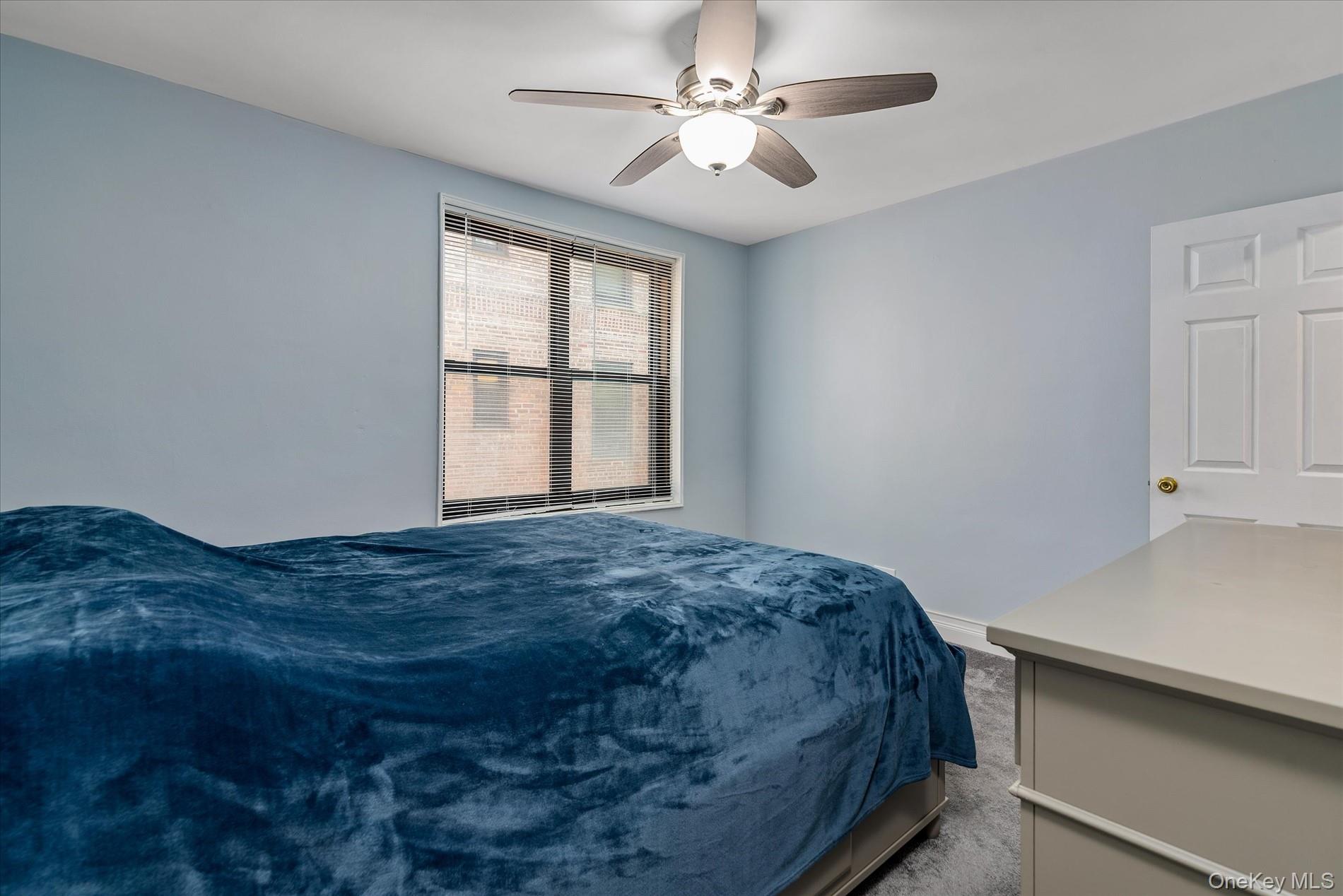 83-30 98th Street, Unit 5A Queens, NY 11421 - Photo 13 of 15 Bedroom featuring carpet floors, a ceiling fan, and baseboards