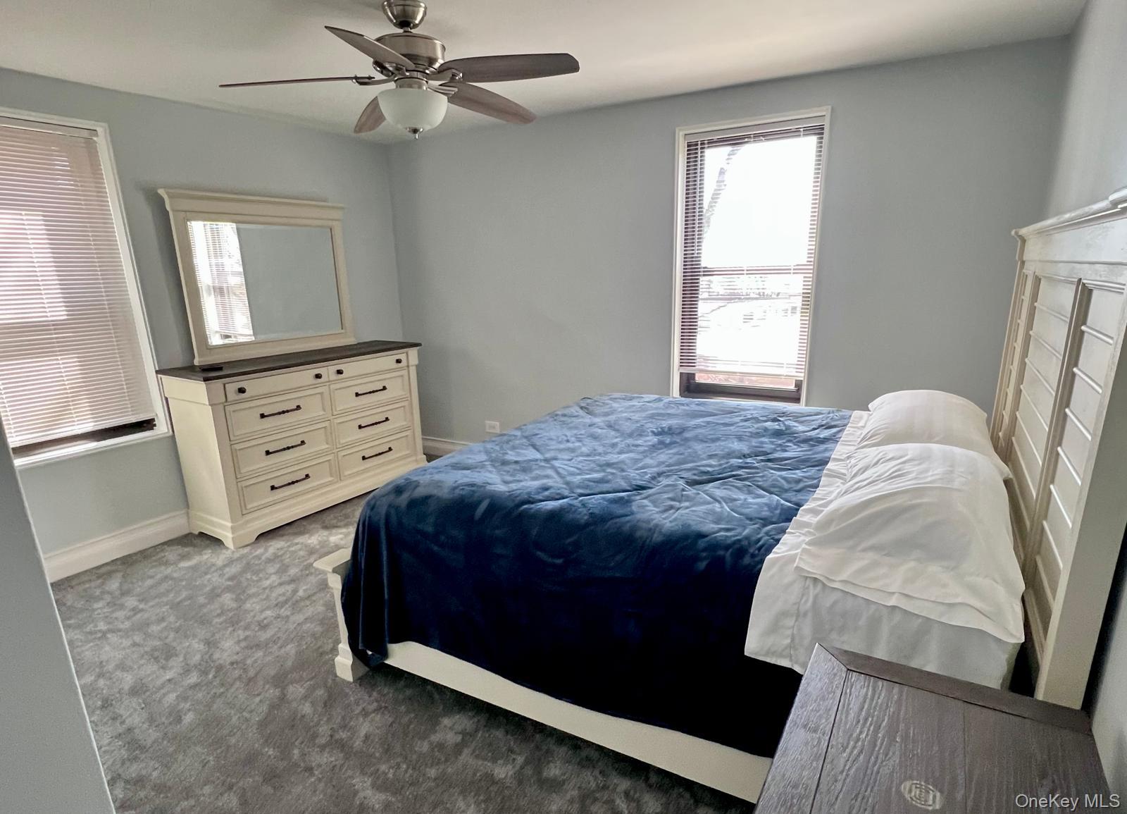 83-30 98th Street, Unit 5A Queens, NY 11421 - Photo 10 of 15 Carpeted bedroom with baseboards and a ceiling fan