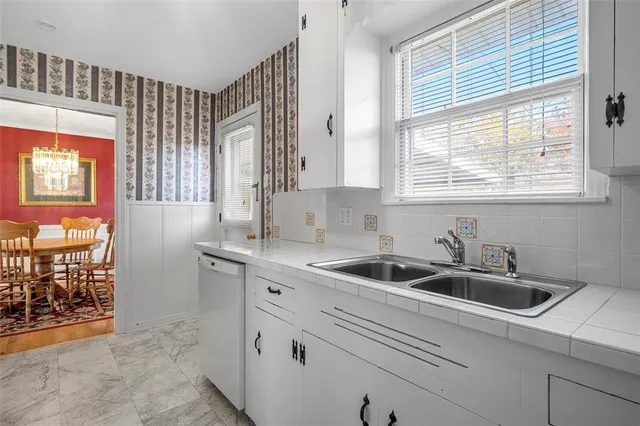 a kitchen that has a sink and a window