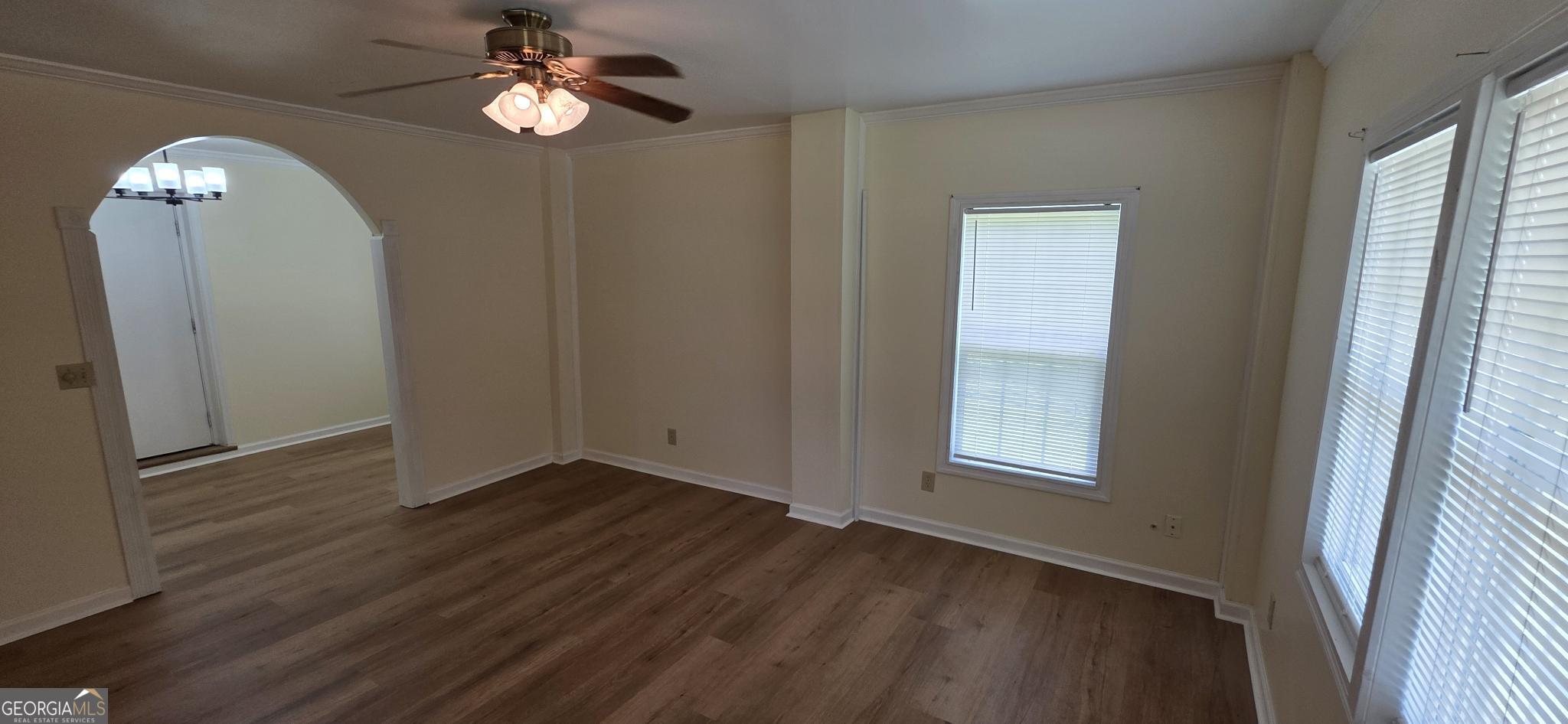 657 Tom McKinley Road Thomaston, GA 30286 - Photo 14 of 32 wooden floor in an empty room with a window