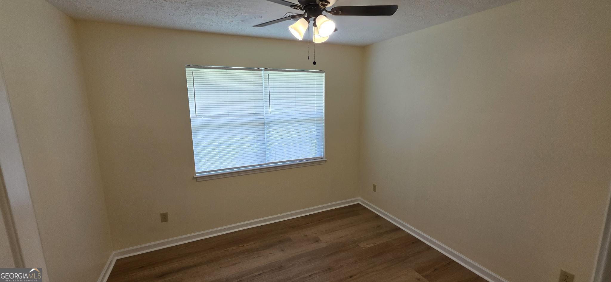 657 Tom McKinley Road Thomaston, GA 30286 - Photo 22 of 32 a view of room with window and ceiling fan