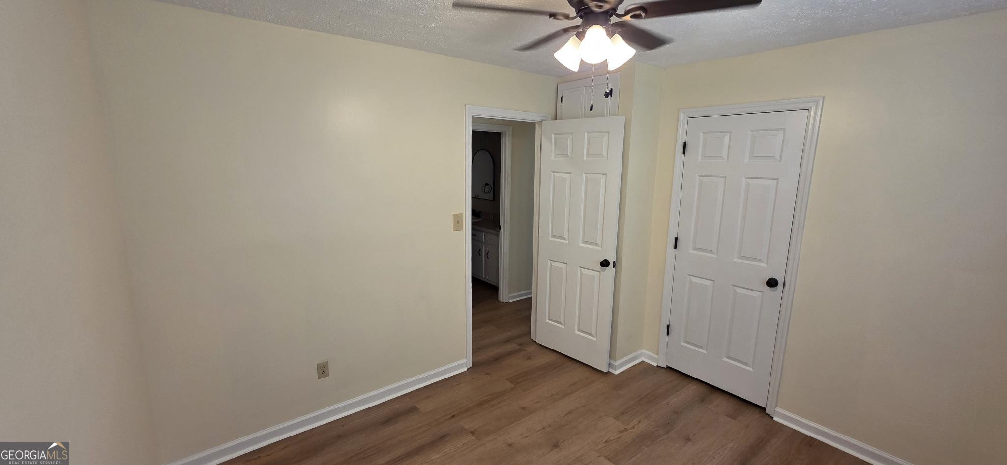657 Tom McKinley Road Thomaston, GA 30286 - Photo 23 of 32 wooden floor in an empty room