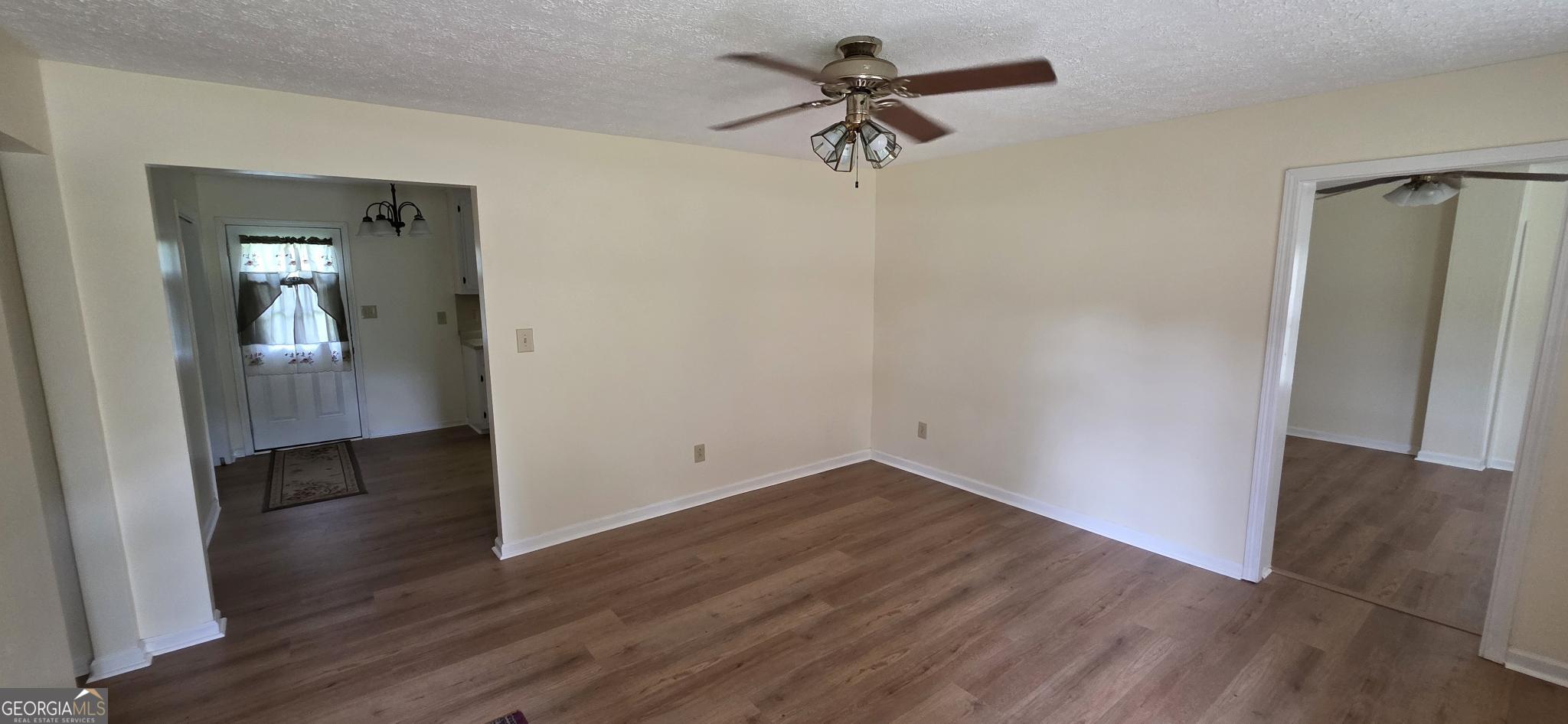 657 Tom McKinley Road Thomaston, GA 30286 - Photo 10 of 32 wooden floor in an empty room with a window