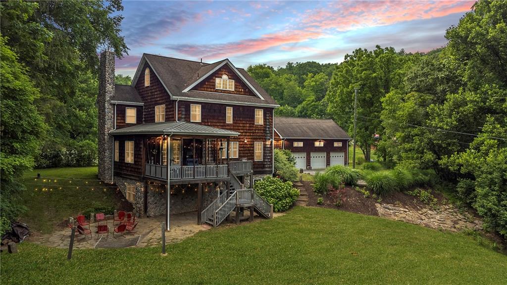 1150 River Road Freeport, PA 16229 - Photo 1 of 16 a front view of a house with garden