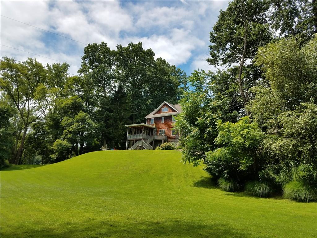 1150 River Road Freeport, PA 16229 - Photo 13 of 16 a view of a house with a yard potted plants and large tree