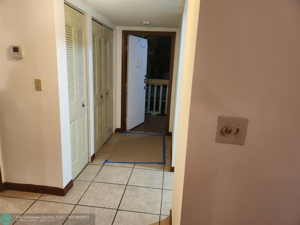 5830 Northwest 64th Avenue, Unit 209 Fort Lauderdale, FL 33319 - Photo 5 of 9 a view of a hallway to rooms