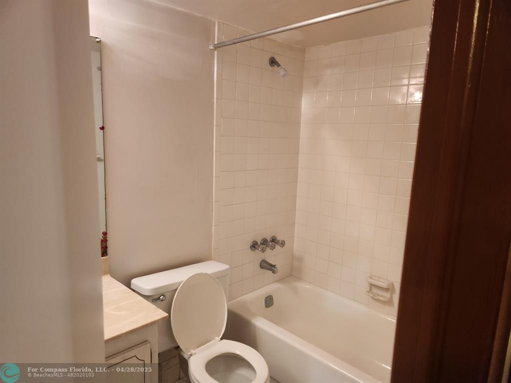 5830 Northwest 64th Avenue, Unit 209 Fort Lauderdale, FL 33319 - Photo 6 of 9 a bathroom with a bathtub and a shower