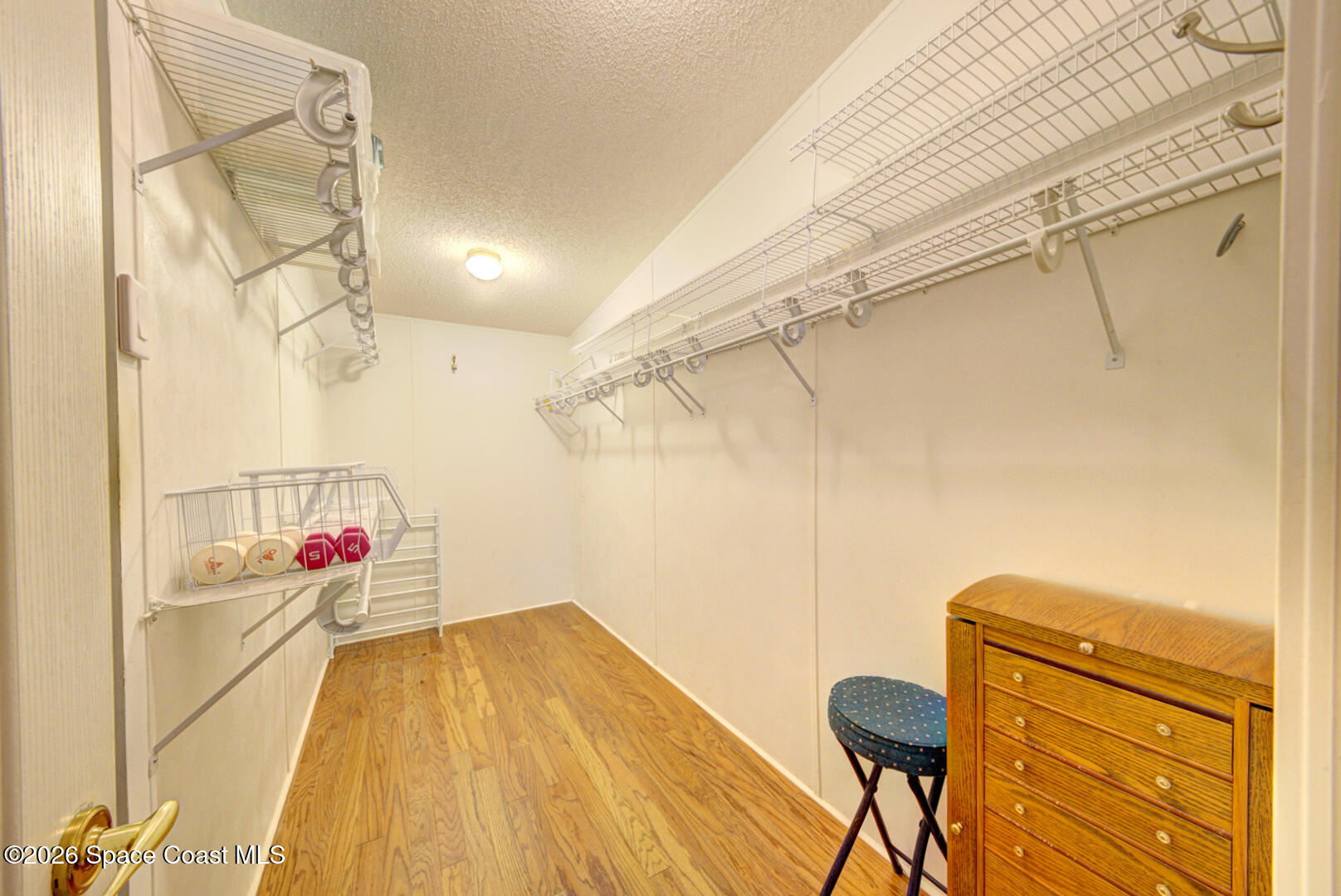 176 Woodsmill Boulevard, Unit 177 Cocoa, FL 32926 - Photo 19 of 63 17 primary bedroom walk-in closet