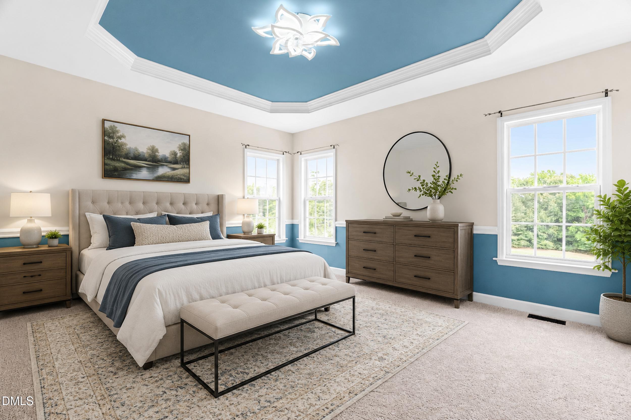 744 Seastone Street Raleigh, NC 27603 - Photo 27 of 53 a bedroom with a bed and a chandelier