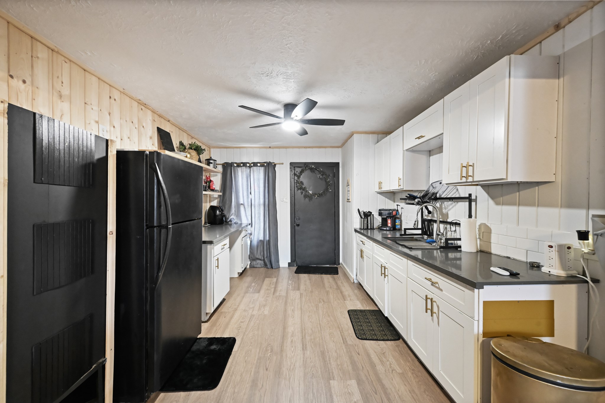 3705 Bremond Street, Unit 1 Houston, TX 77004 - Photo 4 of 14 a kitchen with stainless steel appliances a refrigerator a sink a stove and cabinets