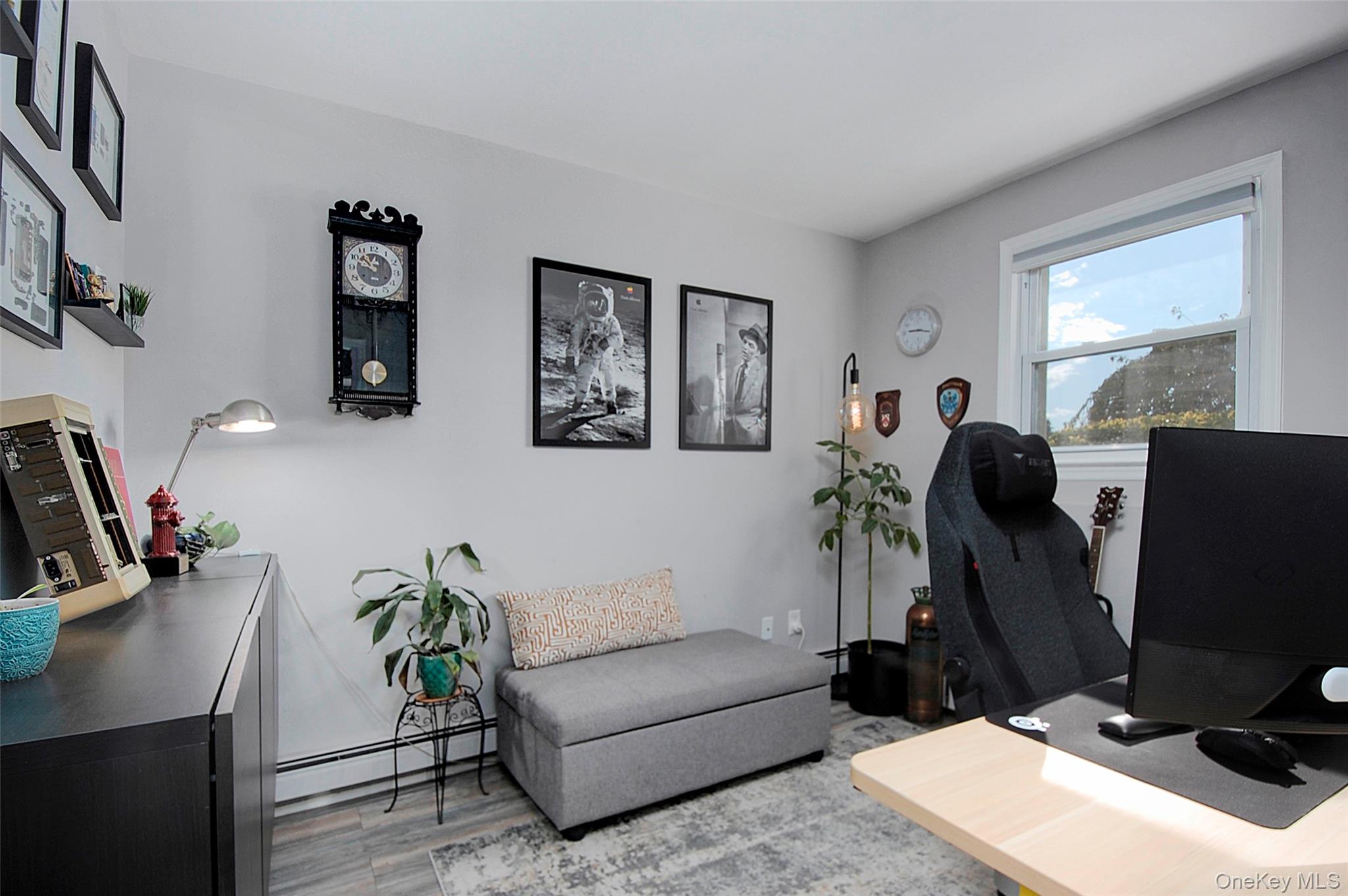 9 Prospect Place Suffern, NY 10901 - Photo 11 of 13 a living room with furniture and a flat screen tv