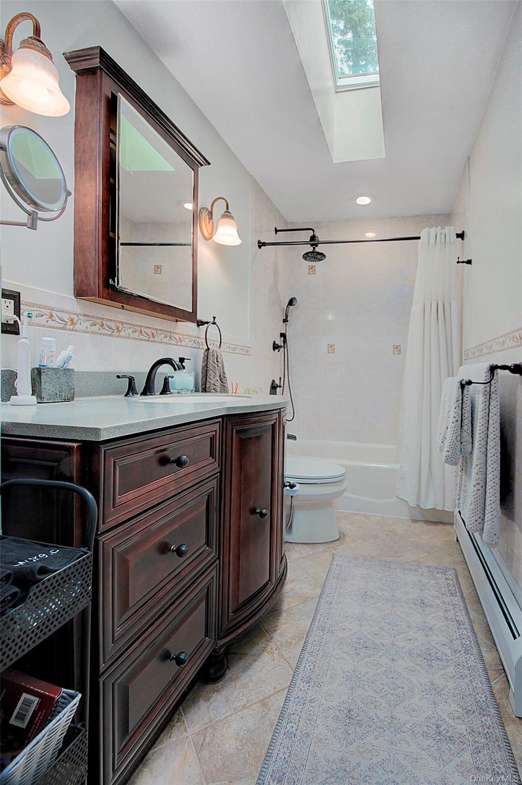 9 Prospect Place Suffern, NY 10901 - Photo 6 of 13 a bathroom with a sink a double vanity and a mirror