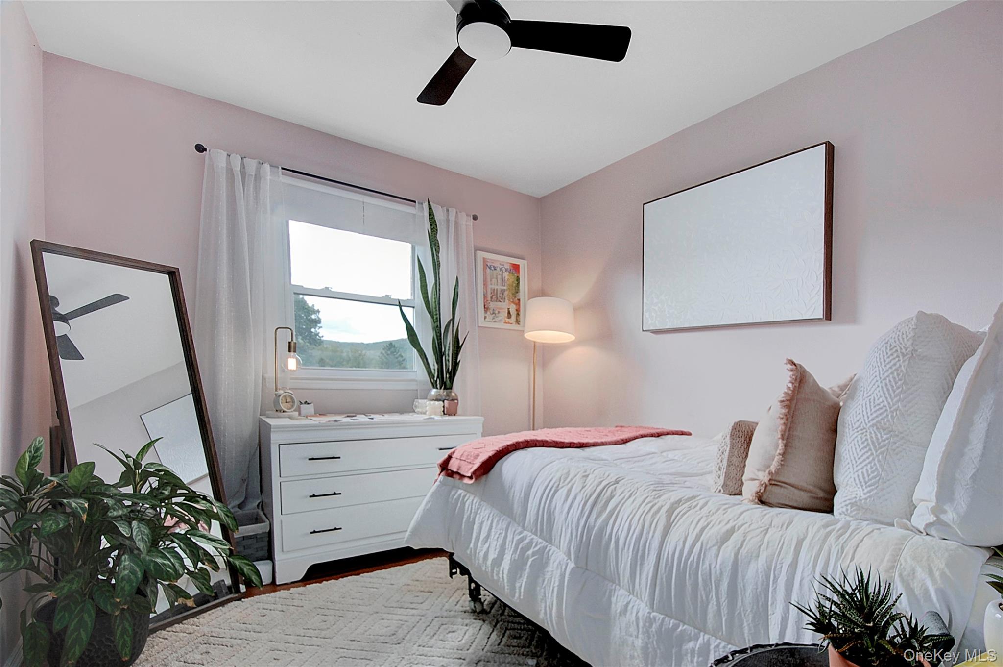 9 Prospect Place Suffern, NY 10901 - Photo 8 of 13 a bedroom with a bed and a window