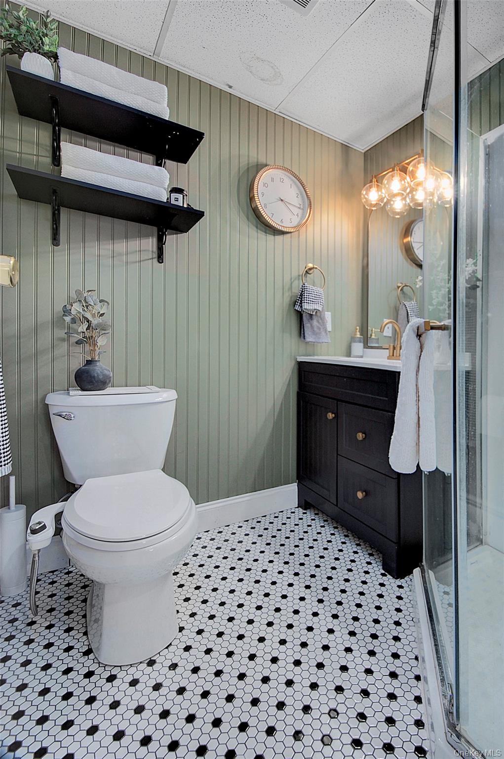 9 Prospect Place Suffern, NY 10901 - Photo 9 of 13 a bathroom with a sink a toilet and shower