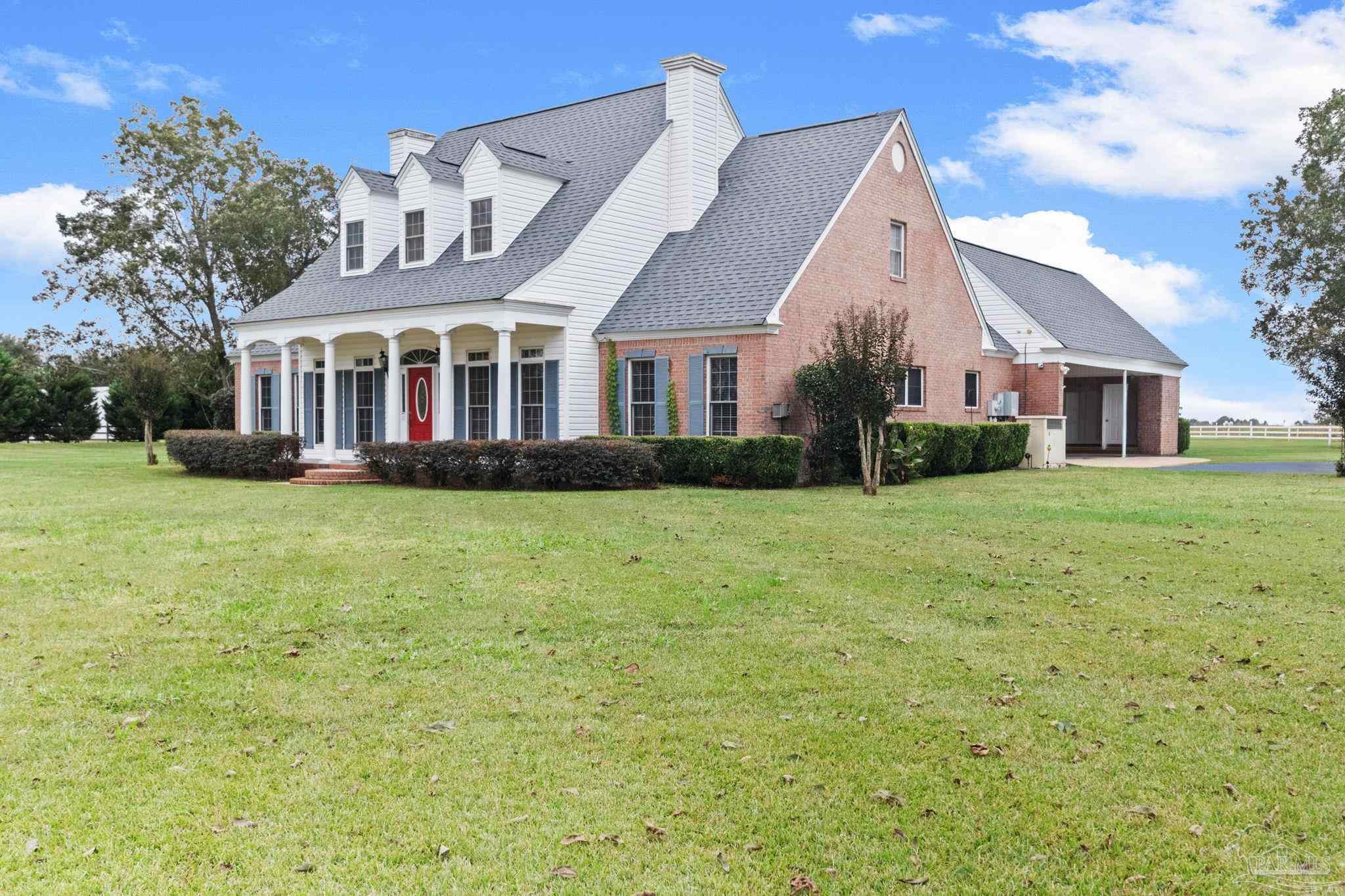10734 Highway 31 Atmore, AL 36502 - Photo 3 of 65 a front view of house with yard and green space