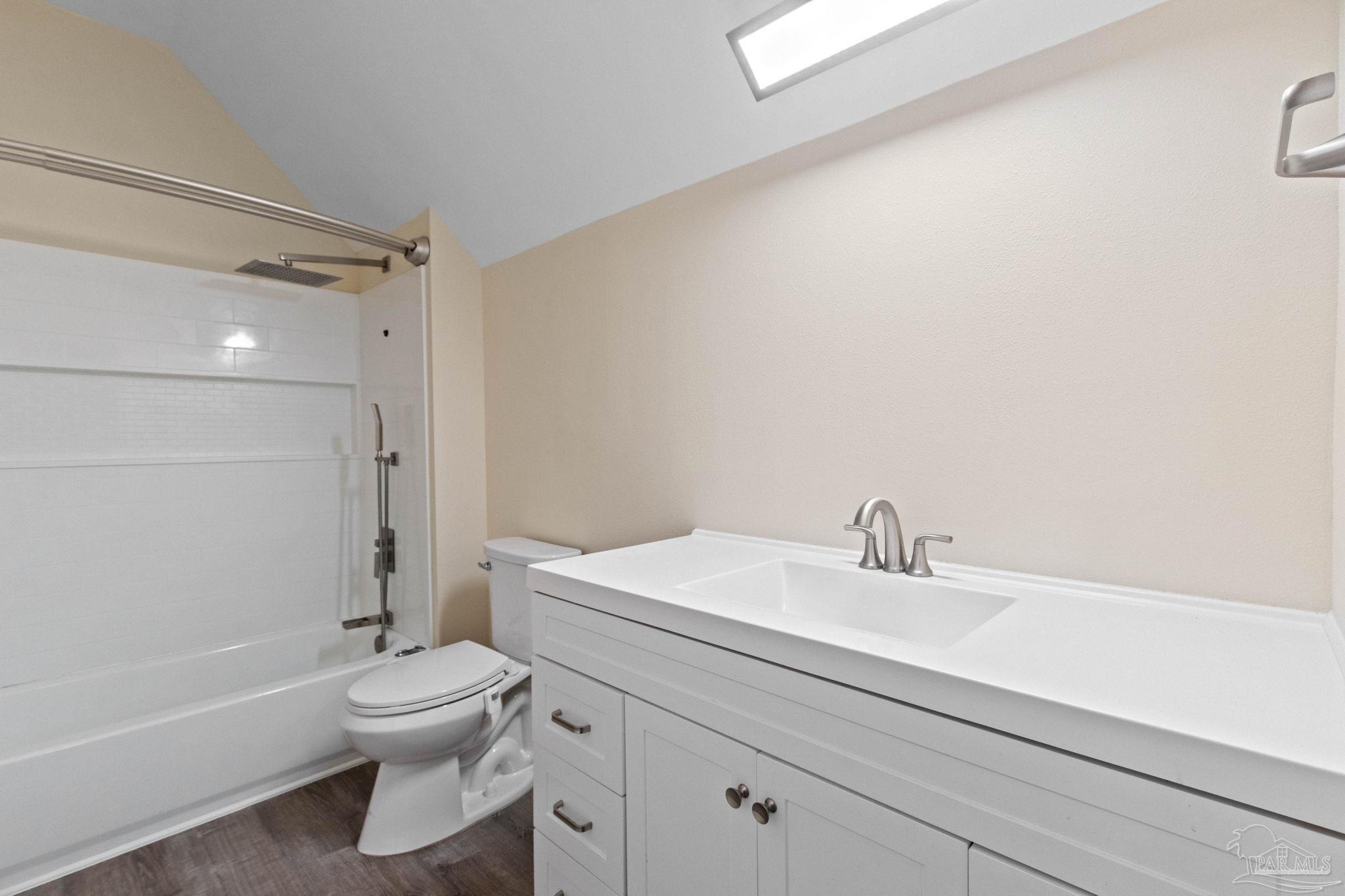 10734 Highway 31 Atmore, AL 36502 - Photo 40 of 65 a bathroom with a sink a toilet and a bathtub