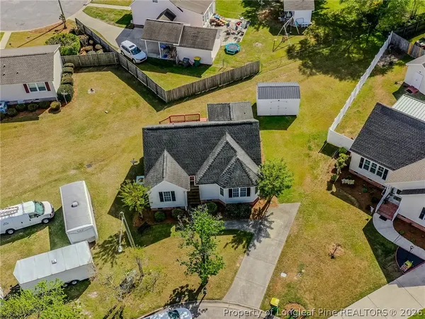 an aerial view of a house with swimming pool