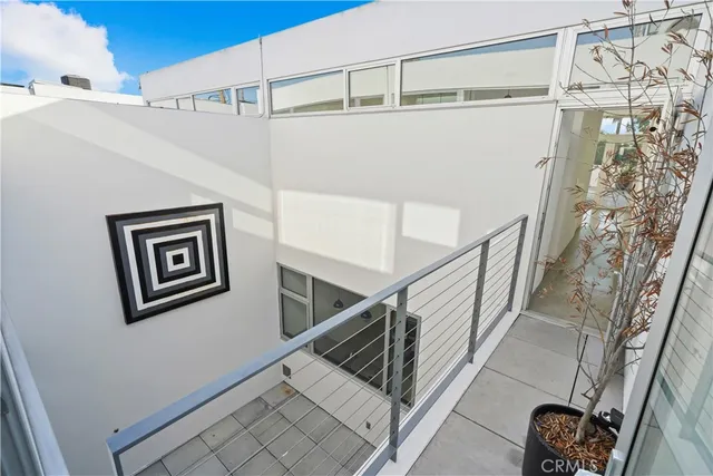 a big room with chandelier and windows
