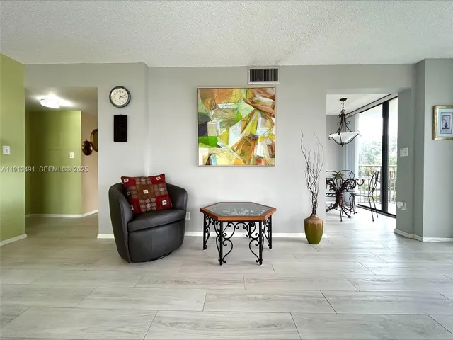 a living room with furniture and a table