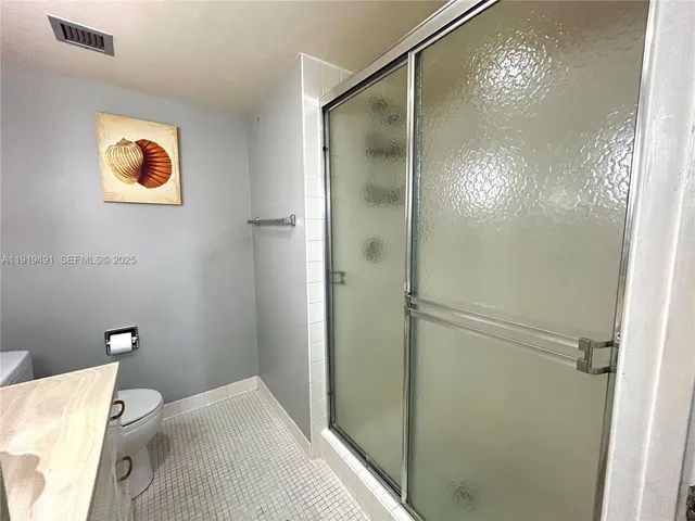 a bathroom with a bathtub and shower