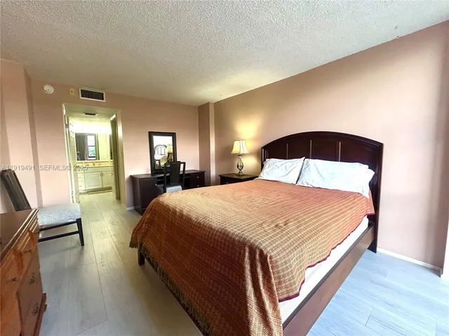 a bathroom with a shower sink and mirror