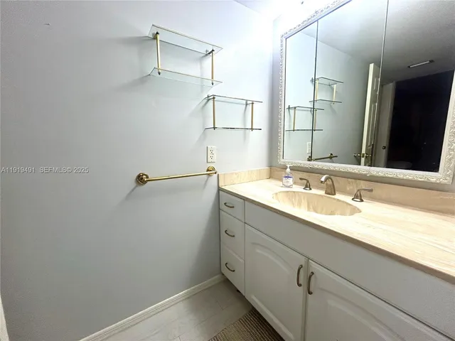 a white toilet sitting next to a bath tub