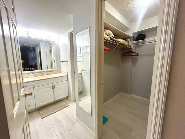 a white toilet sitting next to a bath tub