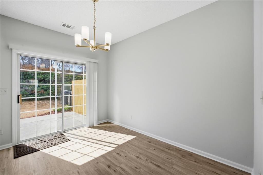 5764 Reps Trace Norcross, GA 30071 - Photo 11 of 32 a view of an empty room with a window