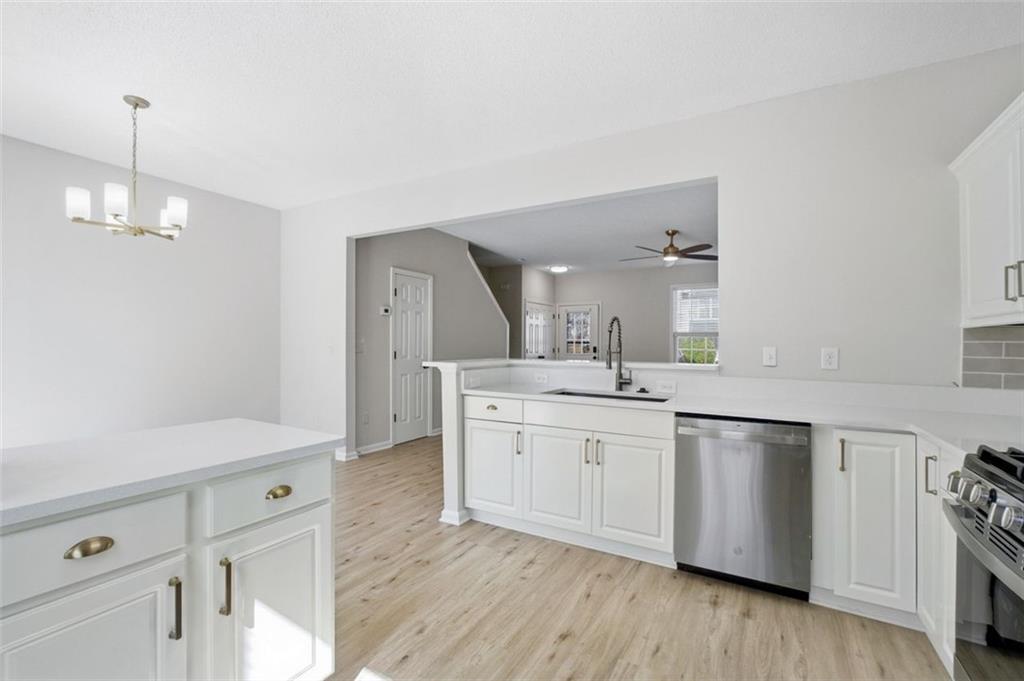 5764 Reps Trace Norcross, GA 30071 - Photo 15 of 32 a spacious bathroom with stainless steel appliances a sink and a large mirror
